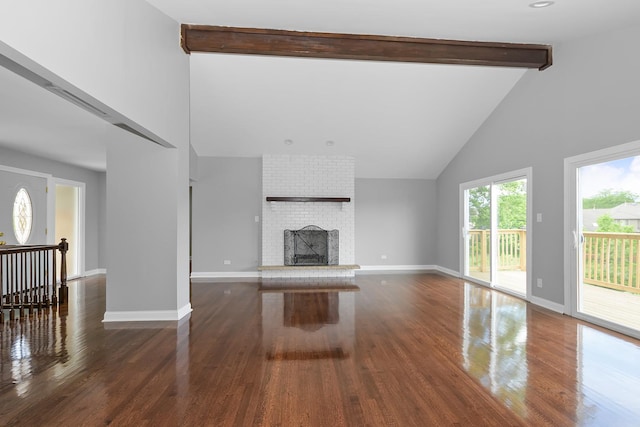 9836 Circle Pkwy, Palos Park, IL 60464 - unfurnished living room featuring high vaulted ceiling, wood finished floors, beam ceiling, baseboards, and a brick fireplace