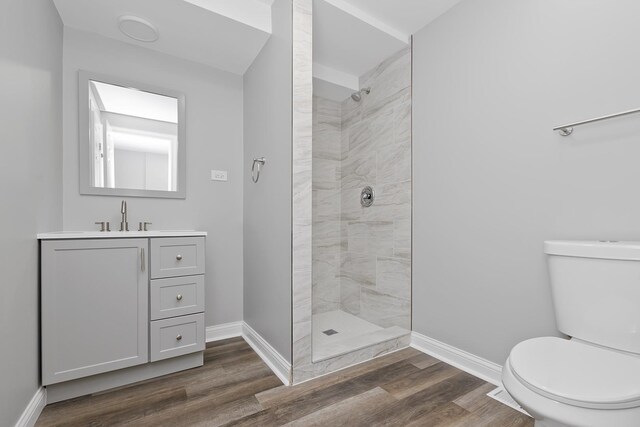 9836 Circle Pkwy, Palos Park, IL 60464 - bathroom featuring toilet, tiled shower, vanity, and wood finished floors
