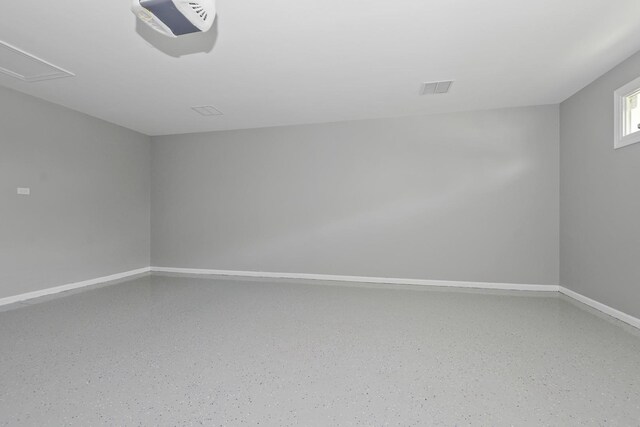 9836 Circle Pkwy, Palos Park, IL 60464 - spare room featuring baseboards, speckled floor, and attic access