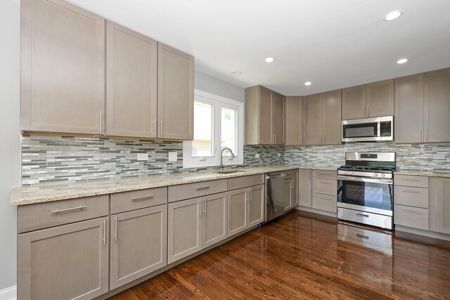 9836 Circle Pkwy, Palos Park, IL 60464 - kitchen featuring stainless steel appliances, a sink, dark wood-style floors, backsplash, and recessed lighting
