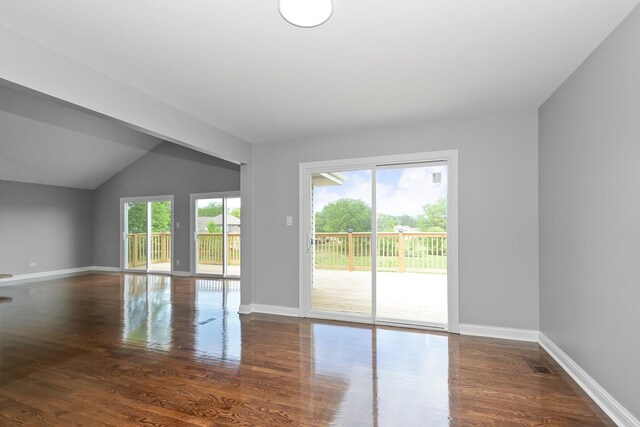 9836 Circle Pkwy, Palos Park, IL 60464 - empty room with wood finished floors, baseboards, and vaulted ceiling