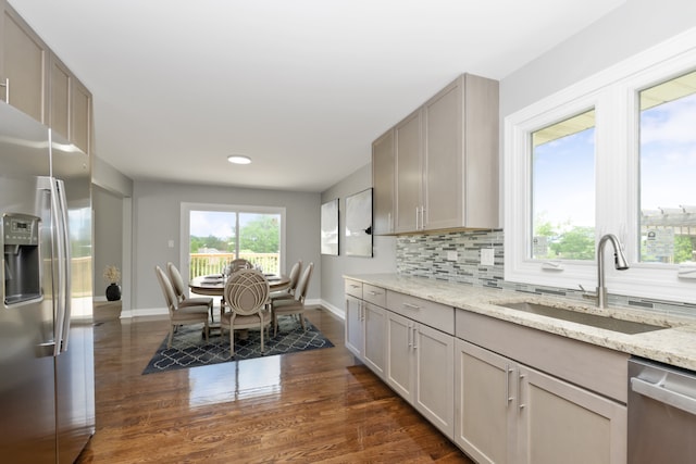 9836 Circle Pkwy, Palos Park, IL 60464 - kitchen with appliances with stainless steel finishes, a sink, baseboards, dark wood-type flooring, and light stone counters
