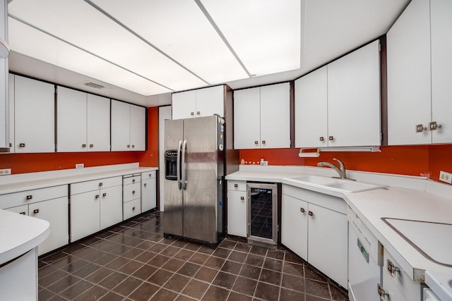 990 N Lake Shore Dr Unit 33E, Chicago, IL 60611 - kitchen featuring stainless steel fridge with ice dispenser, beverage cooler, a sink, dark tile patterned flooring, and light countertops