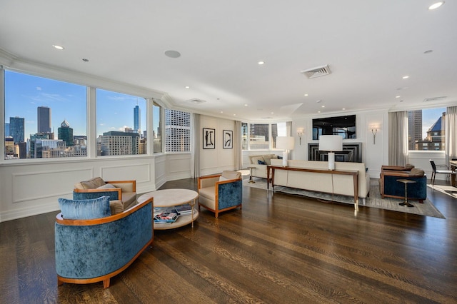 990 N Lake Shore Dr Unit 33E, Chicago, IL 60611 - living area featuring crown molding, wood finished floors, a decorative wall, a skyline view, and recessed lighting