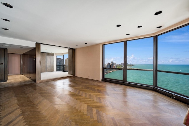 990 N Lake Shore Dr Unit 33E, Chicago, IL 60611 - spare room with expansive windows and a water view