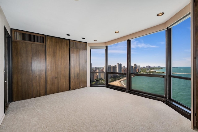 990 N Lake Shore Dr Unit 33E, Chicago, IL 60611 - unfurnished bedroom featuring a water view, carpet, a view of city, and recessed lighting