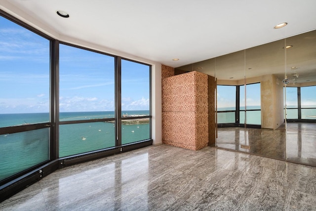 990 N Lake Shore Dr Unit 33E, Chicago, IL 60611 - unfurnished room with a wall of windows and a water view