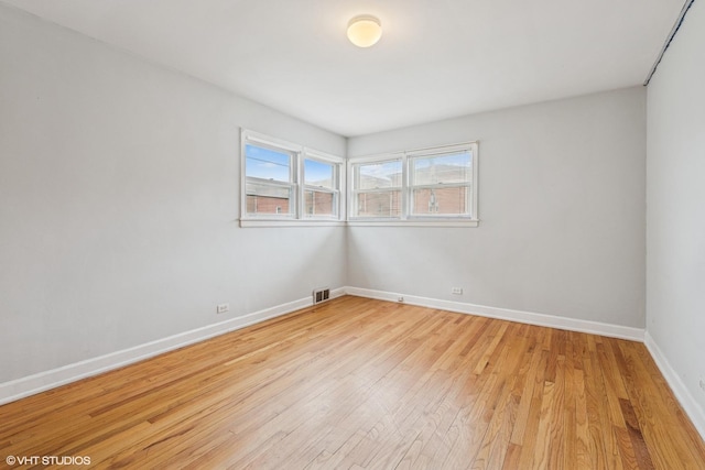 5032 Crain St, Skokie, IL 60077 - spare room featuring light wood-type flooring and baseboards