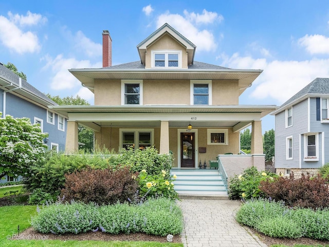 412 7th Ave, La Grange, IL 60525 - traditional style home with stucco siding, covered porch, and a chimney
