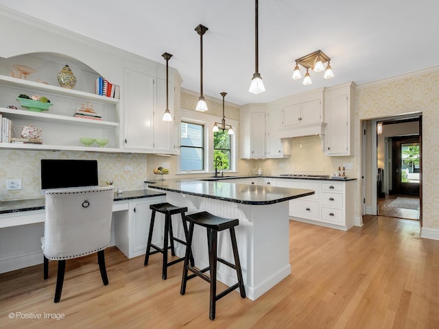 412 7th Ave, La Grange, IL 60525 - kitchen with ornamental molding, white cabinets, and healthy amount of natural light