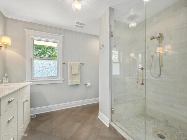 412 7th Ave, La Grange, IL 60525 - bathroom featuring a stall shower, vanity, and tile patterned flooring