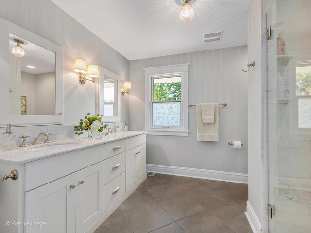 412 7th Ave, La Grange, IL 60525 - full bath featuring double vanity, a shower stall, and tile patterned flooring