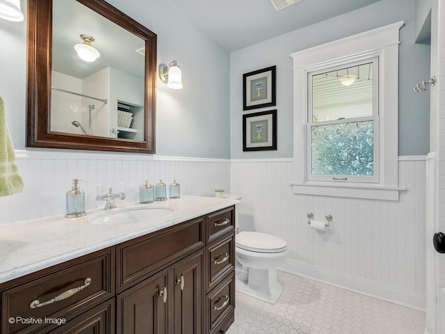 412 7th Ave, La Grange, IL 60525 - full bath with vanity, wainscoting, healthy amount of natural light, and curtained shower