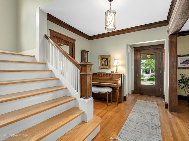 412 7th Ave, La Grange, IL 60525 - entryway featuring stairway, crown molding, and light wood-style flooring