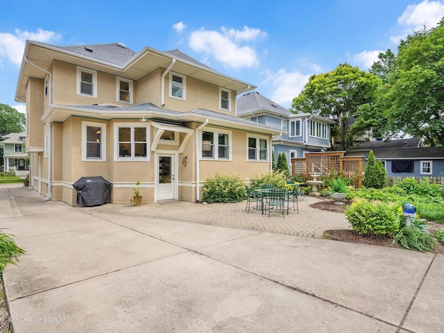 412 7th Ave, La Grange, IL 60525 - view of front facade with stucco siding and a patio area