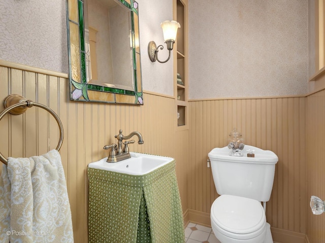 412 7th Ave, La Grange, IL 60525 - half bathroom with a wainscoted wall, wallpapered walls, and tile patterned floors