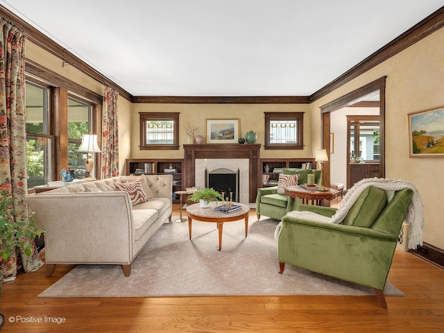 412 7th Ave, La Grange, IL 60525 - living area featuring plenty of natural light, crown molding, light wood-type flooring, and a fireplace