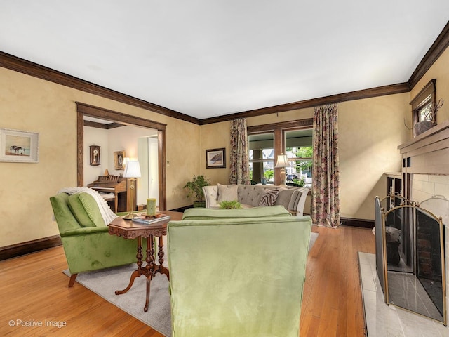 412 7th Ave, La Grange, IL 60525 - living area featuring a fireplace with raised hearth, light wood-style flooring, plenty of natural light, and crown molding