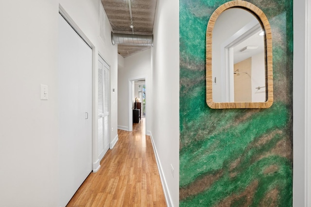 3201 W Leland Ave Unit 205, Chicago, IL 60625 - corridor with light wood finished floors, a high ceiling, and baseboards
