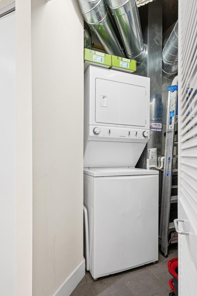 3201 W Leland Ave Unit 205, Chicago, IL 60625 - laundry room featuring stacked washer and clothes dryer and tile patterned flooring