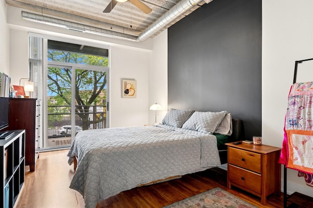 3201 W Leland Ave Unit 205, Chicago, IL 60625 - bedroom with wood finished floors, access to outside, and ceiling fan
