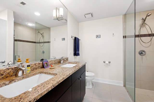 3201 W Leland Ave Unit 205, Chicago, IL 60625 - bathroom with a stall shower, double vanity, toilet, and tile patterned flooring