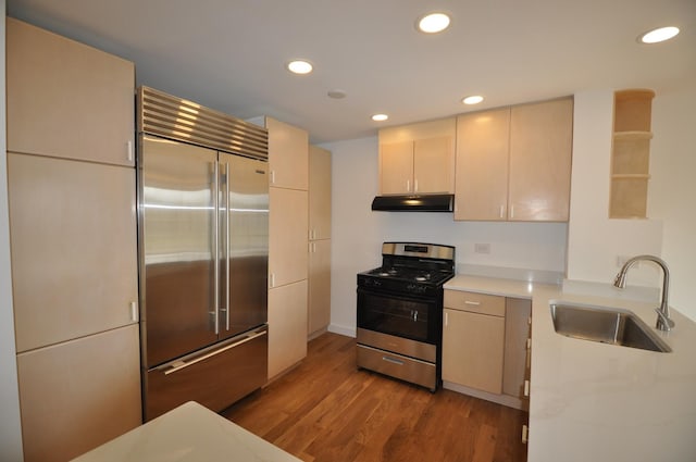 1455 Shermer Rd Unit 506, Northbrook, IL 60062 - kitchen featuring appliances with stainless steel finishes, a sink, under cabinet range hood, recessed lighting, and light countertops