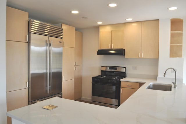 1455 Shermer Rd Unit 506, Northbrook, IL 60062 - kitchen with stainless steel appliances, a sink, under cabinet range hood, light brown cabinets, and recessed lighting