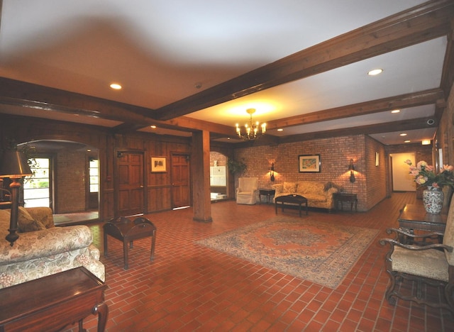1455 Shermer Rd Unit 506, Northbrook, IL 60062 - living room featuring beam ceiling, a chandelier, arched walkways, brick patterned floors, and recessed lighting