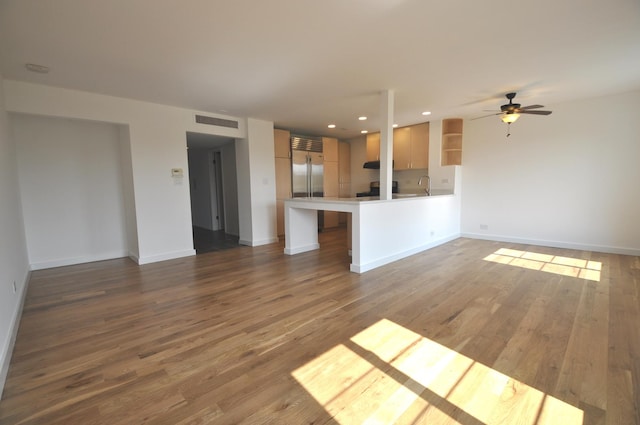1455 Shermer Rd Unit 506, Northbrook, IL 60062 - unfurnished living room featuring wood finished floors, baseboards, a ceiling fan, a sink, and recessed lighting