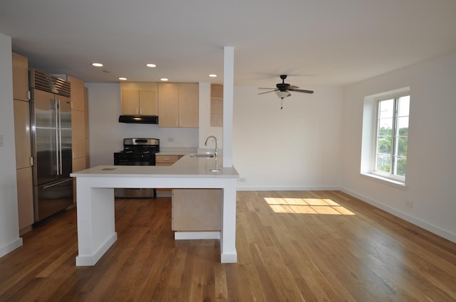 1455 Shermer Rd Unit 506, Northbrook, IL 60062 - kitchen with stainless steel appliances, a peninsula, light countertops, baseboards, and recessed lighting