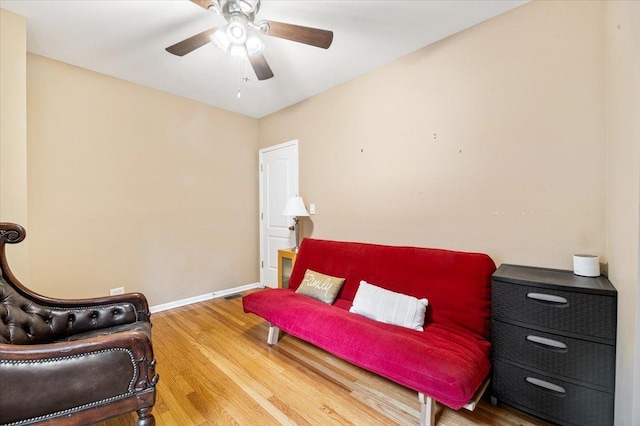 5011 W Deming Pl, Chicago, IL 60639 - living area featuring ceiling fan, wood finished floors, and baseboards