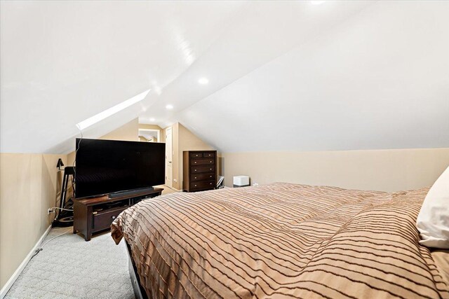 5011 W Deming Pl, Chicago, IL 60639 - bedroom featuring vaulted ceiling, light colored carpet, baseboards, and recessed lighting