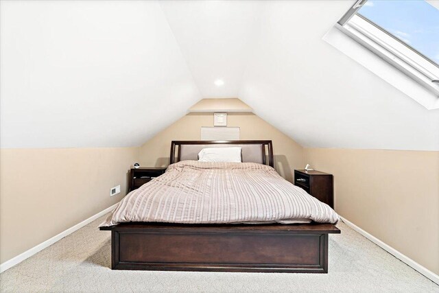 5011 W Deming Pl, Chicago, IL 60639 - bedroom with a skylight, baseboards, carpet flooring, and lofted ceiling