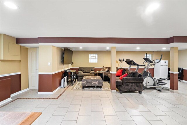 5011 W Deming Pl, Chicago, IL 60639 - basement featuring light tile patterned flooring, baseboards, and recessed lighting