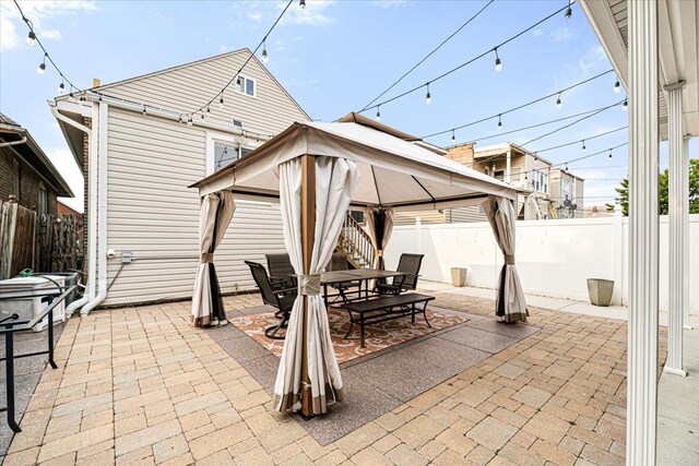 5011 W Deming Pl, Chicago, IL 60639 - view of patio featuring a gazebo and outdoor dining area