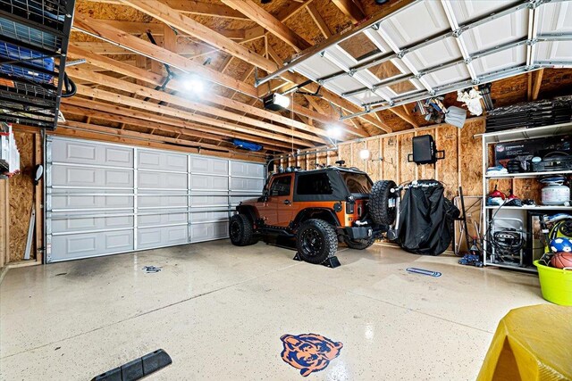5011 W Deming Pl, Chicago, IL 60639 - garage featuring a garage door opener