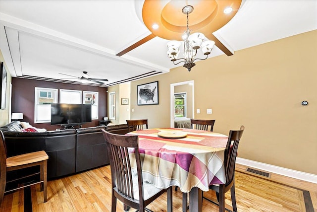 5011 W Deming Pl, Chicago, IL 60639 - dining area with a chandelier, light wood finished floors, ceiling fan, baseboards, and beam ceiling