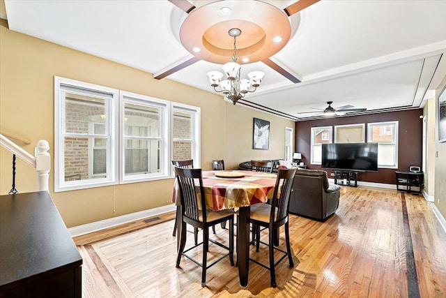 5011 W Deming Pl, Chicago, IL 60639 - dining space featuring light wood finished floors, a chandelier, baseboards, ceiling fan, and beam ceiling