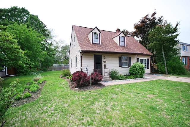6512 N 2nd St, Loves Park, IL 61111 - cape cod home with a chimney and roof with shingles