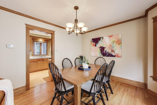820 Woodbine Ave, Oak Park, IL 60302 - dining space with baseboards, a chandelier, light wood-style floors, and ornamental molding