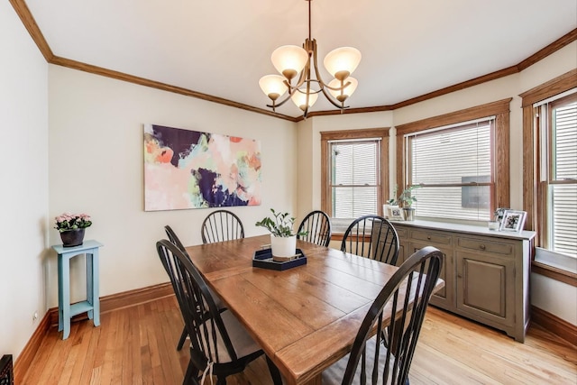 820 Woodbine Ave, Oak Park, IL 60302 - dining room featuring baseboards, light wood finished floors, a chandelier, and ornamental molding