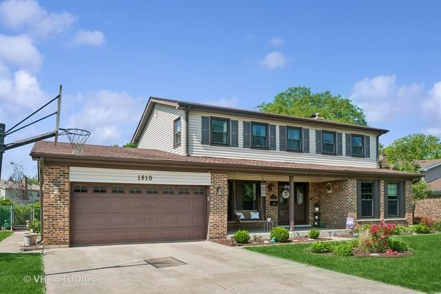1910 E Crabtree Dr, Arlington Heights, IL 60004 - view of front of home with covered porch, driveway, brick siding, and a garage