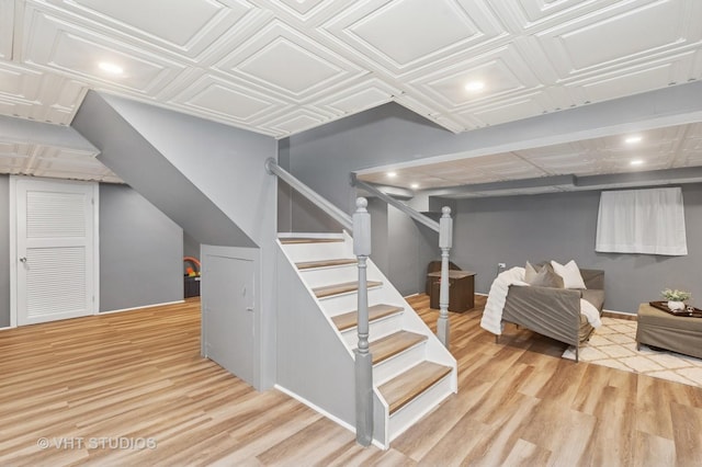 1910 E Crabtree Dr, Arlington Heights, IL 60004 - finished below grade area with wood finished floors, stairs, recessed lighting, and an ornate ceiling