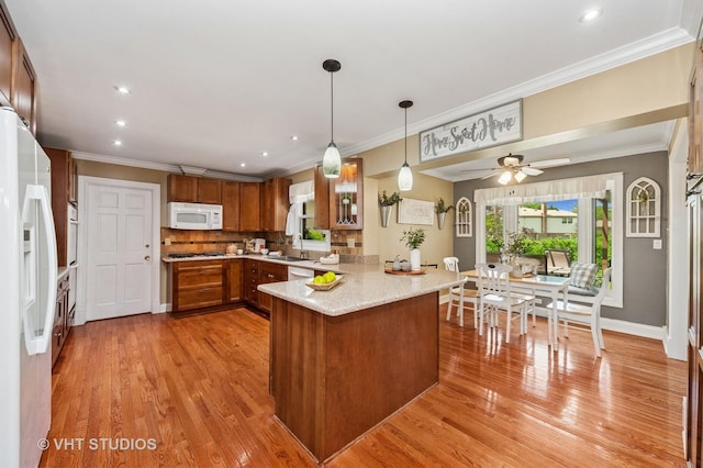 1910 E Crabtree Dr, Arlington Heights, IL 60004 - kitchen with white appliances, a peninsula, brown cabinets, ornamental molding, and light wood-style flooring