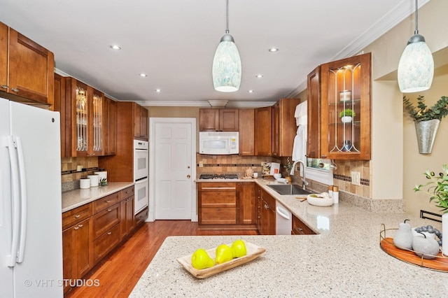 1910 E Crabtree Dr, Arlington Heights, IL 60004 - kitchen with white appliances, brown cabinets, decorative backsplash, ornamental molding, and recessed lighting