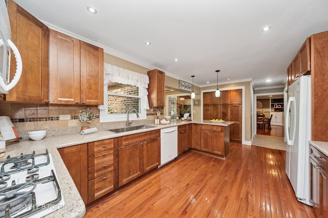 1910 E Crabtree Dr, Arlington Heights, IL 60004 - kitchen featuring white appliances, a peninsula, crown molding, light wood finished floors, and brown cabinetry