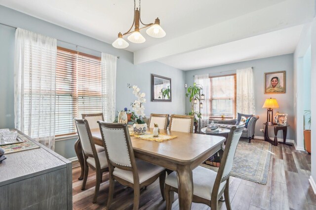 779 W Mystic Ln, Romeoville, IL 60446 - dining space with a chandelier, plenty of natural light, wood finished floors, and baseboards