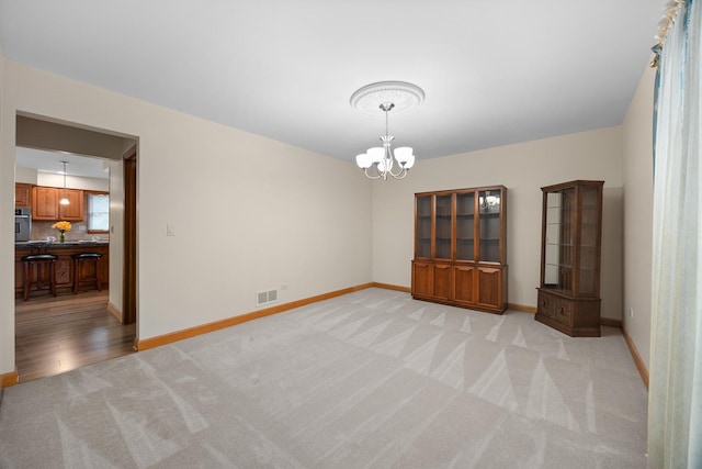1291 Acorn Ct, Sleepy Hollow, IL 60118 - unfurnished dining area featuring light colored carpet and a chandelier