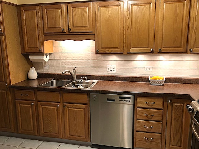 460 S NW Hwy Unit 409, Park Ridge, IL 60068 - kitchen with stainless steel appliances, a sink, dark countertops, and tasteful backsplash